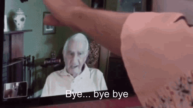 an elderly man is on a video call and the words bye bye are on the screen