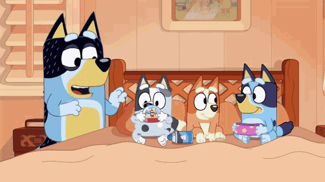 a group of cartoon dogs are laying on a bed together