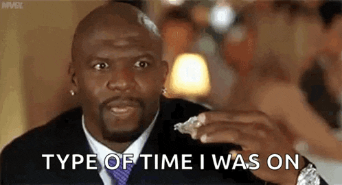 a man in a suit and tie is holding a piece of food in his hand and says `` type of time i was on '' .