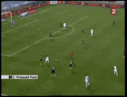 a soccer game is being played on a tv screen with the number 2 on it
