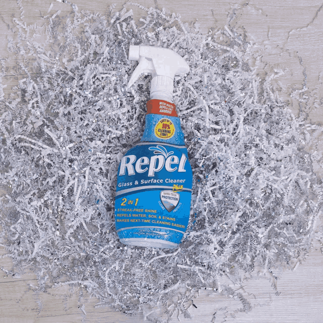 a blue bottle of repel glass and surface cleaner