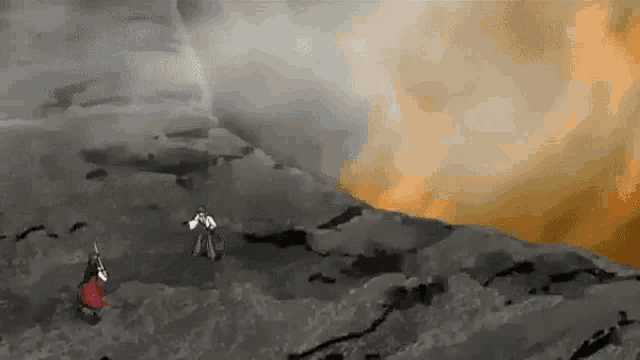 a man and a woman are standing on top of a mountain .