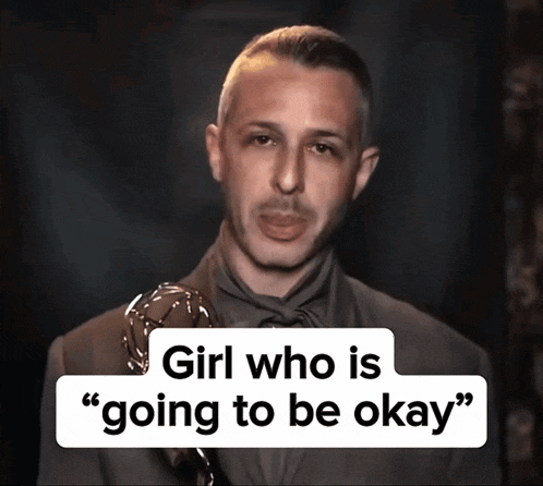 a man holding a trophy with the words " girl who is going to be okay " behind him