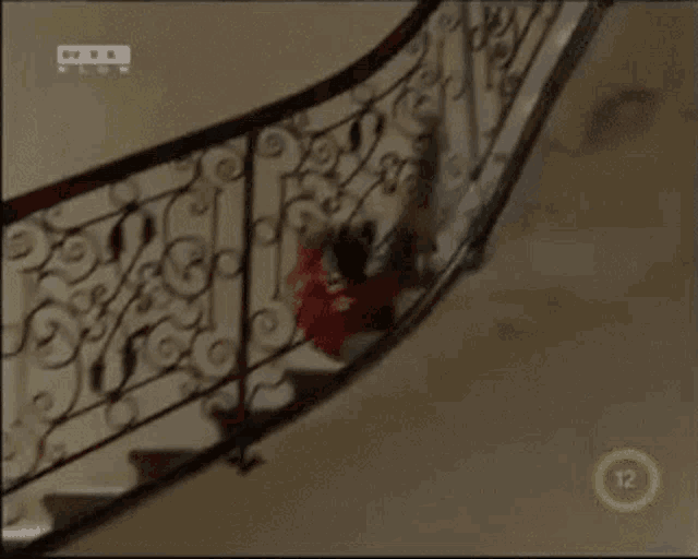 a man is falling down a set of stairs with a rtl logo on the bottom