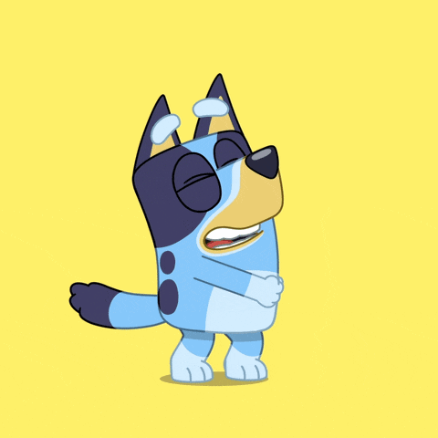 a blue and black dog with its eyes closed and its mouth open