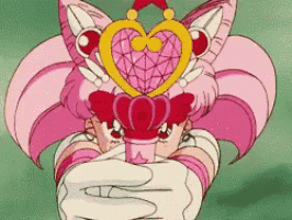 a cartoon character is holding a heart shaped object in her hand