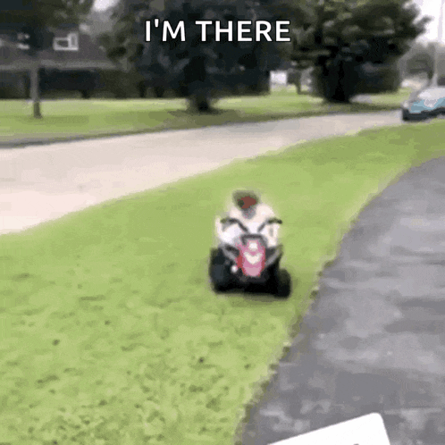 a person is riding a lawn mower down a street .
