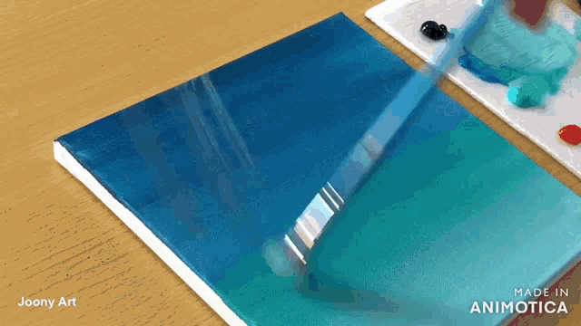 a painting is being painted on a canvas with the words made in animatica on the bottom