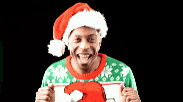 a man wearing a santa hat and an ugly christmas sweater with the number 3 on it