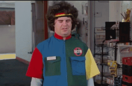 a man wearing a colorful jacket with a sticker on it that says ' subway '