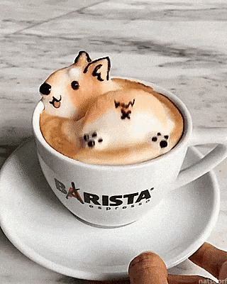 a cup of coffee with a dog made out of marshmallows