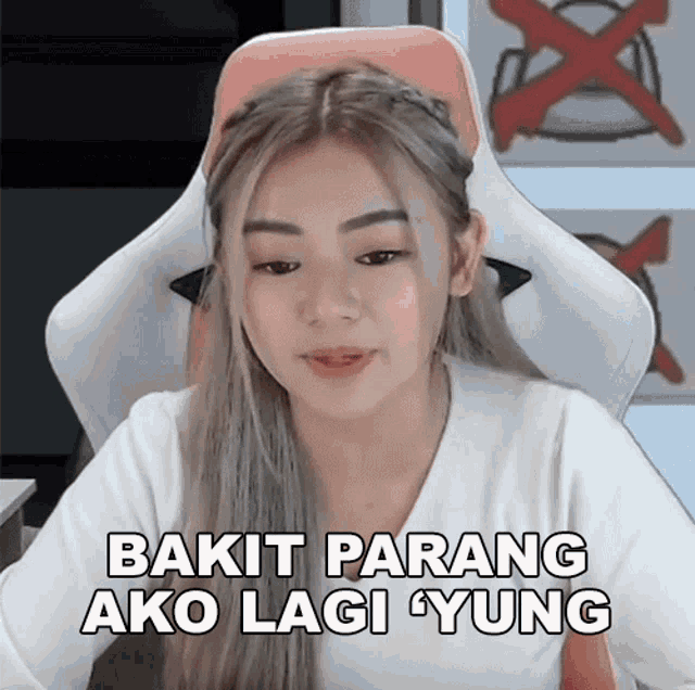 a woman sitting in a chair with the words bakit parang ako lagi yung