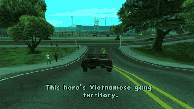 a car is driving down a street with the words this here 's vietnamese gang territory on the bottom