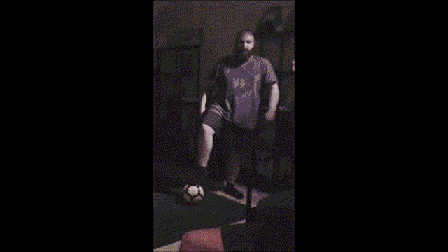 a blurred image of a man standing on a field
