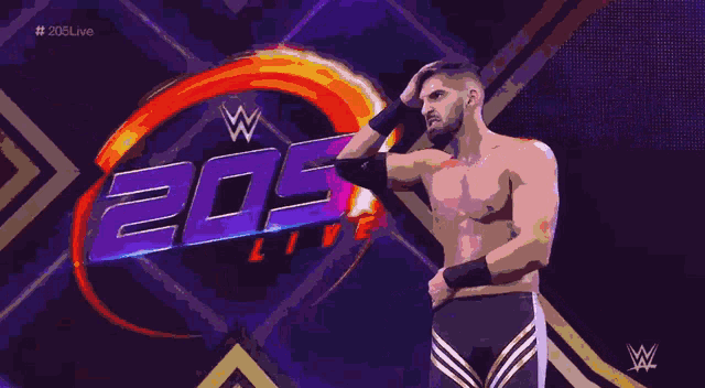 a shirtless wrestler stands in front of a sign that says 204 live