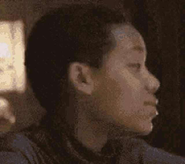 a close up of a man 's face with a surprised look on his face