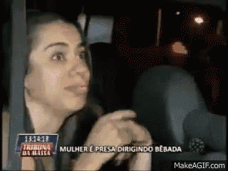 a woman sitting in a car with the time 131438 on the bottom right