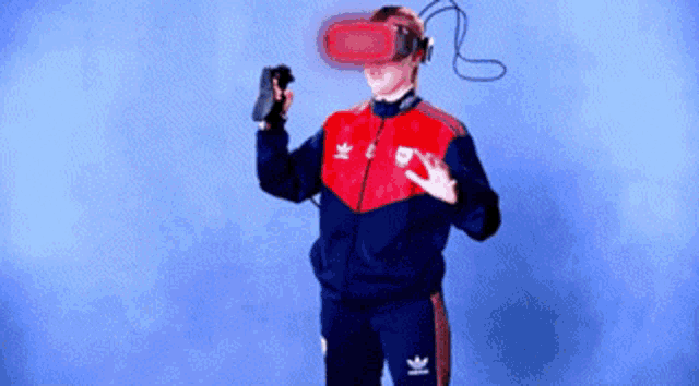 a person wearing a virtual reality headset with an adidas logo on their jacket