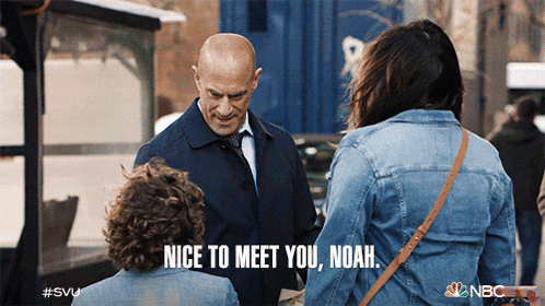 a man in a suit and tie is talking to a woman in a denim jacket and says nice to meet you noah