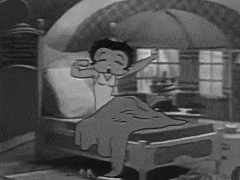 a black and white cartoon of betty boop waking up in bed