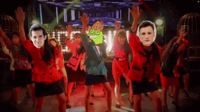 a group of people are dancing with their arms in the air and one of them has a mask on their face