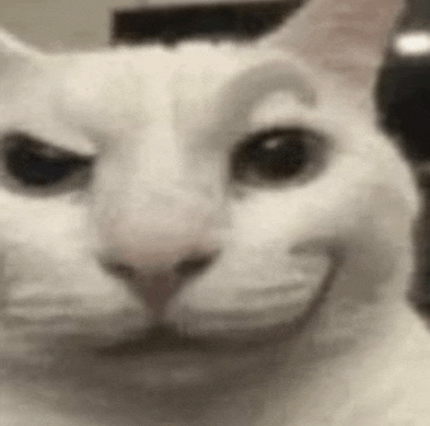 a close up of a white cat making a funny face with its mouth open .