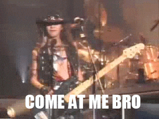 a man is playing a guitar and singing into a microphone with the words come at me bro behind him