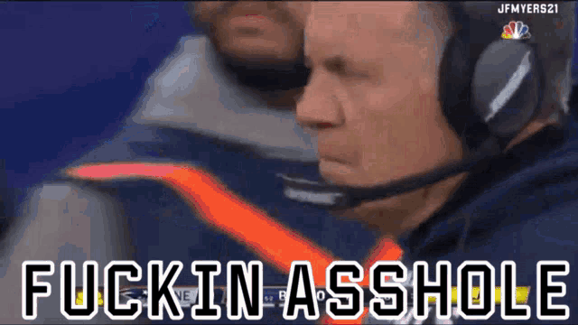 a man wearing headphones says fuckin asshole