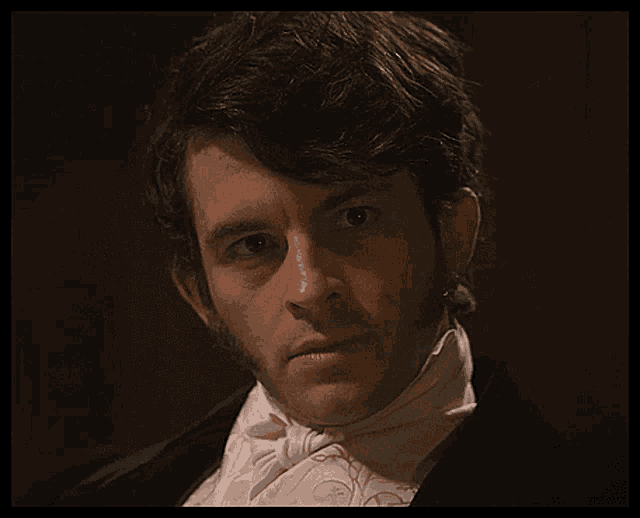 a man in a tuxedo with a bow tie
