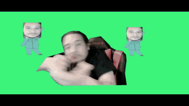 a man wearing a black shirt with the number 0 on it stands in front of a green screen