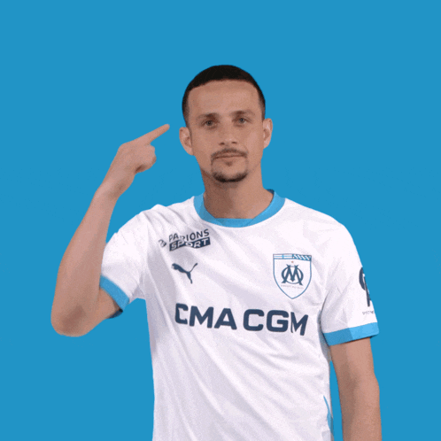 a man wearing a white shirt with cma cgm on the front