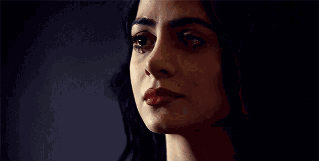a woman with tears running down her face