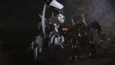 a group of people are standing in a dark room with smoke coming out of their mouths .