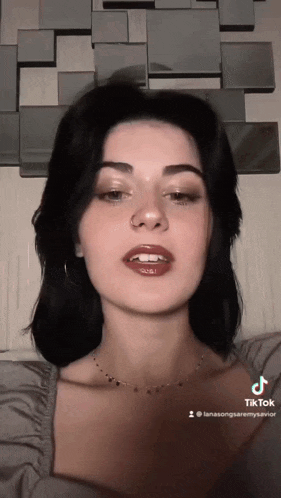 a woman 's face is shown in a tiktok video ..