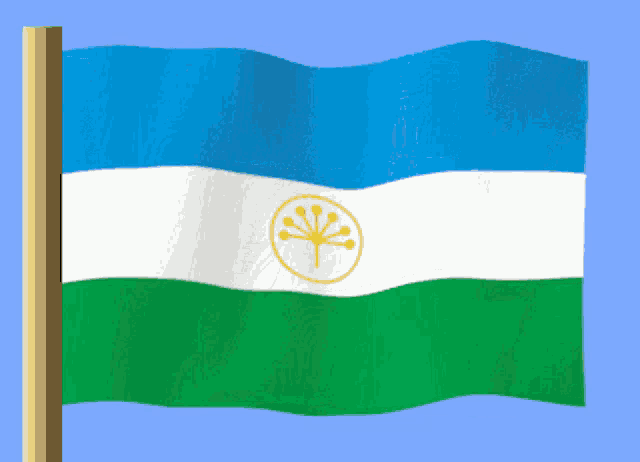 a blue white and green flag with a yellow tree on it