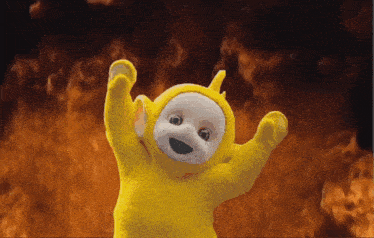 a yellow teddy bear with its arms in the air