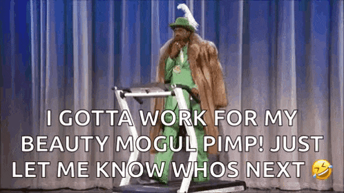 a man in a fur coat and hat is standing on a treadmill on a stage .