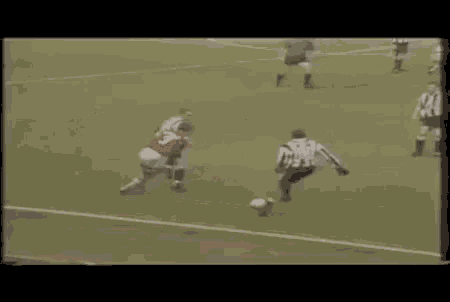a group of soccer players are playing a game on a soccer field .
