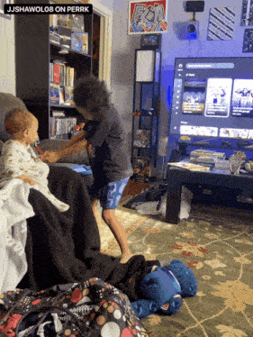 two children are playing in a living room with a sign that says ps4 on it