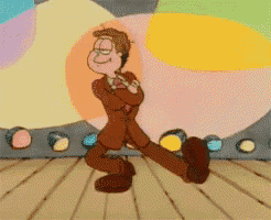 a garfield cartoon character is walking on a stage with his arms crossed