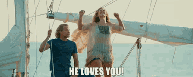 a man and a woman on a sailboat with the words he loves you above them