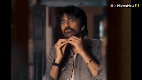 a man playing a harmonica with a mightymate118 watermark