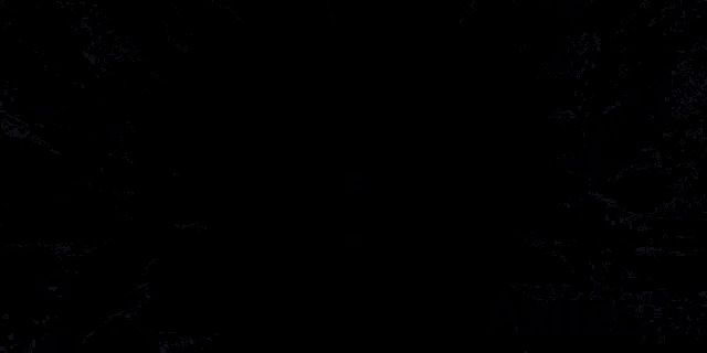 a black background with a blue and white explosion in the center