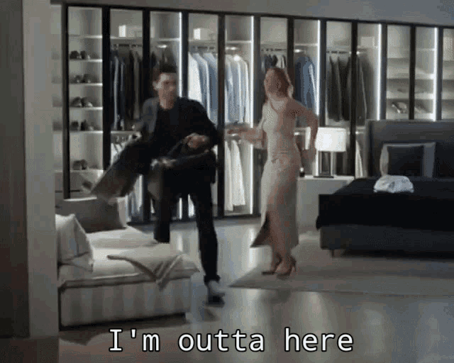 a man and a woman in a bedroom with the words i 'm outta here below them