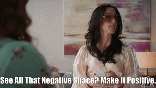 a woman wearing sunglasses says " see all that negative space "