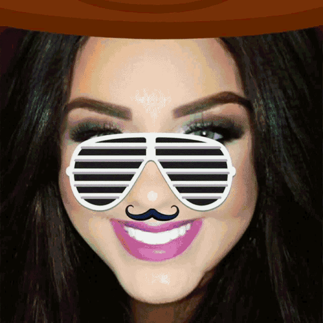 a woman wearing sunglasses with a fake mustache on her face