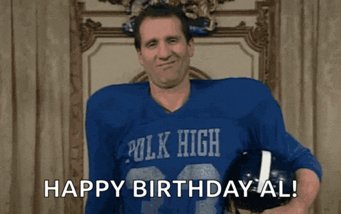 a man wearing a blue polk high jersey holds a football