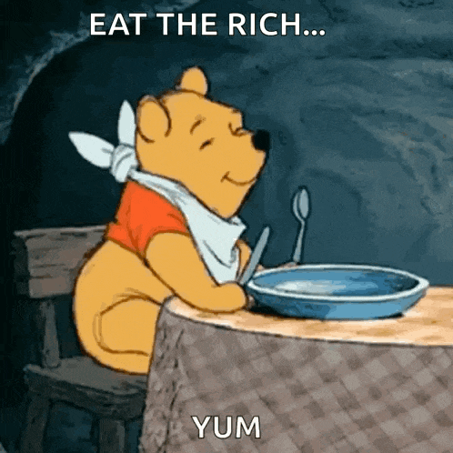 winnie the pooh is sitting at a table with a bowl of food and a spoon in his hand .