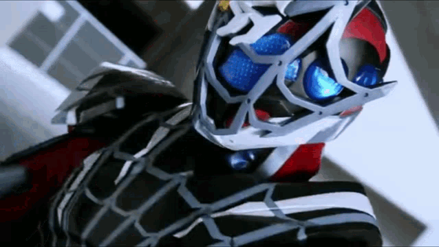 a close up of a person in a mask with blue eyes