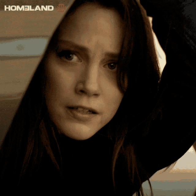a close up of a woman 's face with the word homeland on the bottom right